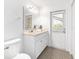 Bathroom with a single vanity sink, marble countertop, and tiled floor with a window view at 2899 Sw 66 St, Ocala, FL 34476