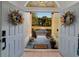 Open doorway views a long driveway and a charming outdoor space at 2899 Sw 66 St, Ocala, FL 34476