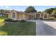 Charming home with well-manicured lawn and inviting curb appeal, featuring a two-car garage and a welcoming entrance at 2899 Sw 66 St, Ocala, FL 34476