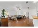 Open living room boasting a sectional sofa, hardwood floors, and natural light at 2899 Sw 66 St, Ocala, FL 34476