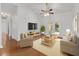 Cozy living room with hardwood floors, ceiling fan, and patio door at 2899 Sw 66 St, Ocala, FL 34476