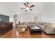 Spacious living room with hardwood floors, comfortable seating, and ample natural light at 2899 Sw 66 St, Ocala, FL 34476
