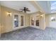 Covered patio boasting brick pavers, a ceiling fan, and convenient access to the home's interior at 2899 Sw 66 St, Ocala, FL 34476