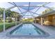 Refreshing screened-in pool with brick pavers offers outdoor relaxation and entertainment at 2899 Sw 66 St, Ocala, FL 34476