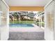 A view of the pool with its screened enclosure from inside the residence at 2899 Sw 66 St, Ocala, FL 34476