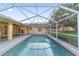 Backyard screened-in pool area with brick pavers for easy relaxation and outdoor fun at 2899 Sw 66 St, Ocala, FL 34476