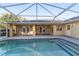 Screened-in pool area featuring a pool with steps, a covered patio, and access to the home at 2899 Sw 66 St, Ocala, FL 34476