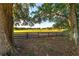 Large grassy field where horses graze behind a rustic wooden fence at 2899 Sw 66 St, Ocala, FL 34476
