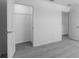 A neutral-toned bedroom shows a closet and an open doorway at 5133 Forget Me Not Ave, Lake Hamilton, FL 33851