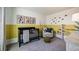 Bright Bedroom featuring a stylish crib, cozy chair, and playful decor, perfect for a modern Gathering at 5133 Forget Me Not Ave, Lake Hamilton, FL 33851