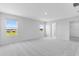 A spacious bedroom features wall-to-wall carpeting and natural light at 5133 Forget Me Not Ave, Lake Hamilton, FL 33851
