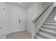 An entryway featuring stairs with carpet and a front door at 5133 Forget Me Not Ave, Lake Hamilton, FL 33851