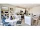 Open concept kitchen with modern appliances, a large island, and an adjacent dining area, perfect for entertaining at 5133 Forget Me Not Ave, Lake Hamilton, FL 33851
