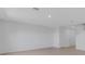 Bright and spacious living room featuring tile flooring and a neutral color scheme, offering a blank canvas for customization at 5133 Forget Me Not Ave, Lake Hamilton, FL 33851