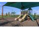 Community playground featuring slides, climbing structures, and a shaded area for children to enjoy outdoor fun at 5133 Forget Me Not Ave, Lake Hamilton, FL 33851
