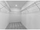 A walk-in closet with shelving for clothing and personal items at 5133 Forget Me Not Ave, Lake Hamilton, FL 33851