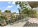 Spacious balcony with metal railing overlooking lush green trees at 1521 Chestnut Ave, Winter Park, FL 32789