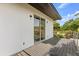 Exterior view of a modern balcony with sliding glass doors and metal railing at 1521 Chestnut Ave, Winter Park, FL 32789