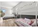 Bright bedroom featuring two beds, hardwood floors, and natural light at 1521 Chestnut Ave, Winter Park, FL 32789