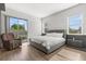 Bedroom with hardwood floors, large windows, and a balcony at 1521 Chestnut Ave, Winter Park, FL 32789
