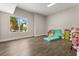Spacious bonus room with wood floors, a large window, and versatile space for recreation or storage at 1521 Chestnut Ave, Winter Park, FL 32789