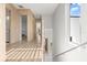 Bright hallway features wood floors, modern railings, and plenty of natural light, with a sleek aesthetic at 1521 Chestnut Ave, Winter Park, FL 32789