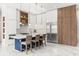 Contemporary kitchen featuring a large island, modern appliances, sleek cabinetry, and stylish pendant lights at 1521 Chestnut Ave, Winter Park, FL 32789
