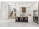 Open-concept kitchen with large island, pendant lighting, modern cabinetry, and adjacent staircase at 1521 Chestnut Ave, Winter Park, FL 32789