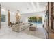 Spacious living room with a large sectional sofa and views of the pool area at 1521 Chestnut Ave, Winter Park, FL 32789