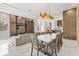 Open-concept living and dining area featuring modern decor, sleek lighting, and a neutral color palette at 1521 Chestnut Ave, Winter Park, FL 32789