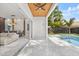 Expansive outdoor patio with a sleek ceiling fan, lounge seating and view of the private pool at 1521 Chestnut Ave, Winter Park, FL 32789