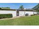 The backyard features a well-maintained lawn, privacy fence, and air conditioning unit at 2049 Se 37Th Court Cir, Ocala, FL 34471