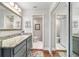 Well-lit bathroom with dual vanities and an attached water closet at 2049 Se 37Th Court Cir, Ocala, FL 34471