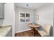 Charming kitchen nook featuring shuttered window and a cozy, round table at 2049 Se 37Th Court Cir, Ocala, FL 34471