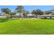 Community pool with well-manicured lawn and gazebo, perfect for relaxation and recreation at 2049 Se 37Th Court Cir, Ocala, FL 34471