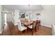 Inviting dining room featuring a wood table, decorative chandelier, and wood-look floors at 2049 Se 37Th Court Cir, Ocala, FL 34471