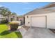 Pleasant home exterior with a single car garage, landscaped yard, and painted white brick at 2049 Se 37Th Court Cir, Ocala, FL 34471