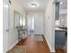 Inviting foyer with wood flooring, console table, mirror, and access to other living spaces at 2049 Se 37Th Court Cir, Ocala, FL 34471