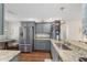 Modern kitchen with granite countertops and stainless steel appliances at 2049 Se 37Th Court Cir, Ocala, FL 34471