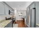 Bright kitchen with gray cabinetry, stainless steel appliances, and breakfast nook at 2049 Se 37Th Court Cir, Ocala, FL 34471