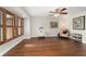 Bright living room with wood floors, plantation shutters, neutral walls, and tasteful decor at 2049 Se 37Th Court Cir, Ocala, FL 34471