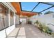Large tiled patio features a ceiling fan, plants, and an open-air design at 2049 Se 37Th Court Cir, Ocala, FL 34471