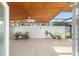 Enclosed patio with tiled floors, ceiling fan, and outdoor plants at 2049 Se 37Th Court Cir, Ocala, FL 34471