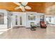 Spacious tiled patio featuring a ceiling fan and comfortable outdoor furniture at 2049 Se 37Th Court Cir, Ocala, FL 34471