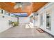 Bright enclosed patio with tiled flooring and ceiling fan at 2049 Se 37Th Court Cir, Ocala, FL 34471