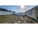 Large backyard enclosed by a white fence, offering privacy and ample space at 224 Nova Dr, Davenport, FL 33837