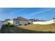 Spacious backyard with potential for landscaping, featuring a privacy fence at 224 Nova Dr, Davenport, FL 33837