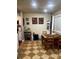 Bright dining area with checkered floors, a dining table, and a window with natural light at 5127 Eaglesmere Dr # A02, Orlando, FL 32819