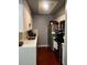 Well-lit kitchen with modern appliances, white cabinets, and ample counter space for cooking at 5127 Eaglesmere Dr # A02, Orlando, FL 32819