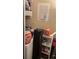 Efficient laundry area with storage shelves, offering practical space for laundry supplies and organization at 5127 Eaglesmere Dr # A02, Orlando, FL 32819